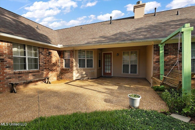104 Willington Way, Madison, MS 39110 - rear view of property with roof with shingles, a chimney, brick siding, and a patio area