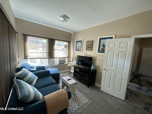 living room featuring baseboards and lofted ceiling