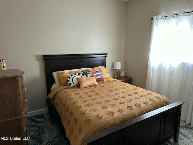 bedroom with baseboards