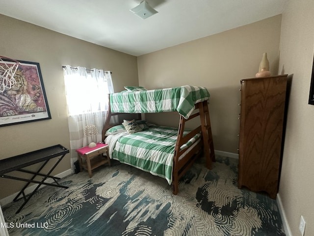 carpeted bedroom with baseboards