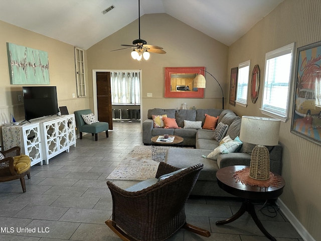 living room featuring visible vents, a healthy amount of sunlight, and high vaulted ceiling