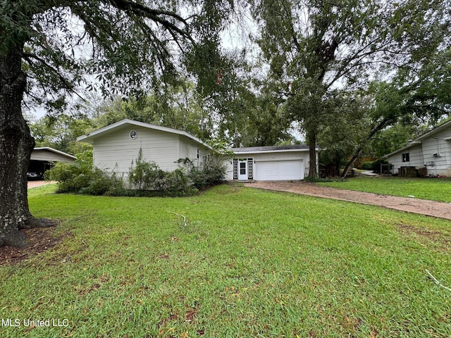 ranch-style home with a front yard and a garage