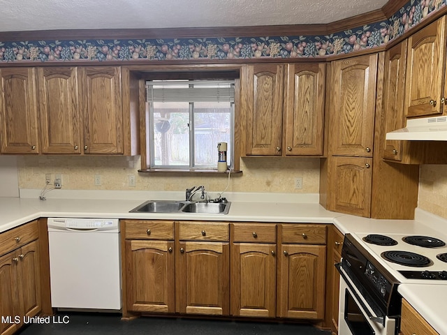 kitchen featuring sink, a textured ceiling, and white appliances