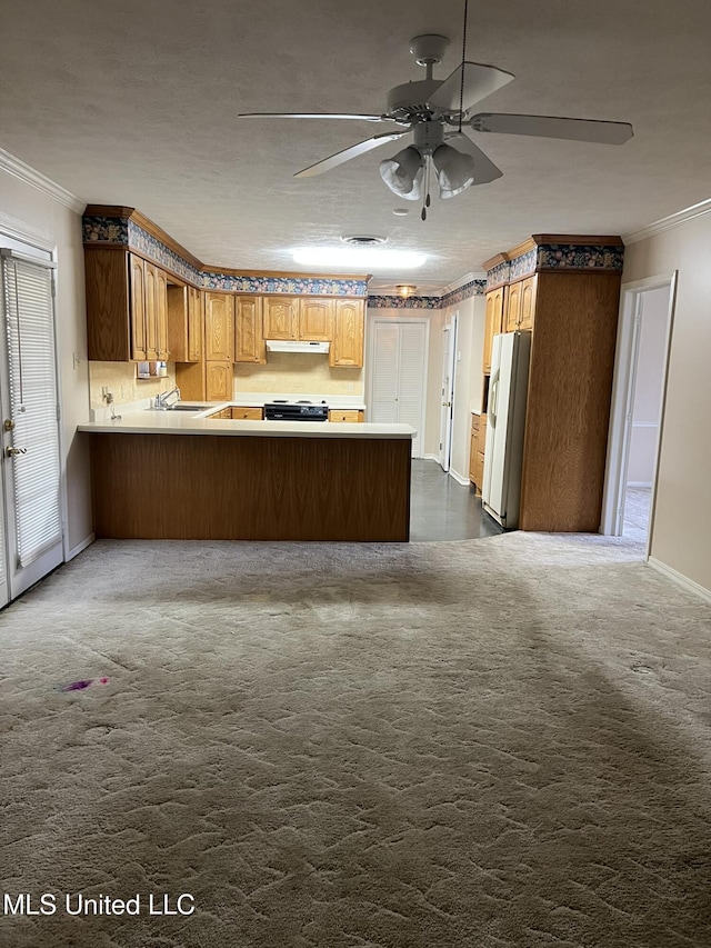 kitchen with crown molding, range with electric cooktop, dark colored carpet, white refrigerator, and kitchen peninsula