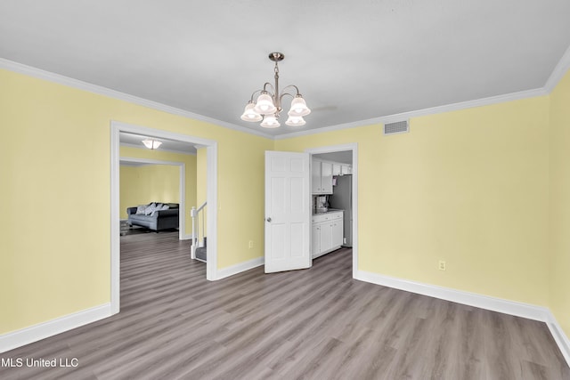 112 Rolling Meadows Dr, Jackson, MS 39211 - unfurnished dining area with baseboards, wood finished floors, a chandelier, and crown molding