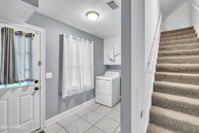 112 Rolling Meadows Dr, Jackson, MS 39211 - laundry room with washer / clothes dryer, light marble finish flooring, baseboards, and a textured ceiling