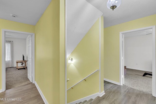 112 Rolling Meadows Dr, Jackson, MS 39211 - hallway featuring wood finished floors, baseboards, and an upstairs landing