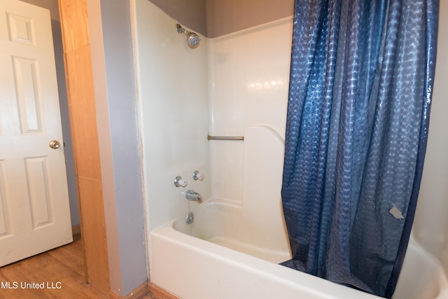 bathroom featuring hardwood / wood-style floors and shower / tub combo