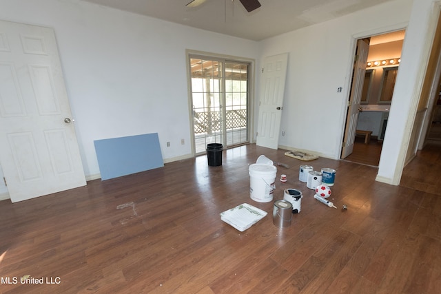 unfurnished bedroom featuring connected bathroom, ceiling fan, dark hardwood / wood-style floors, and access to exterior