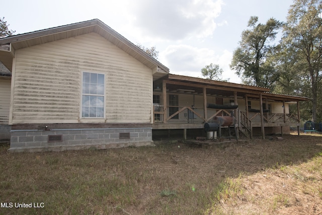 back of property with a deck