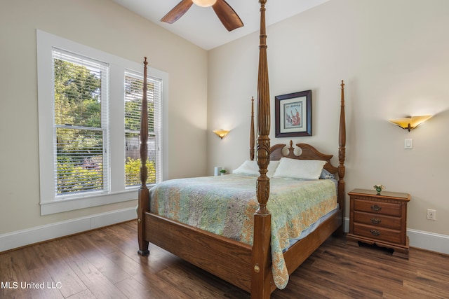 bedroom featuring lofted ceiling, dark wood-type flooring, and ceiling fan