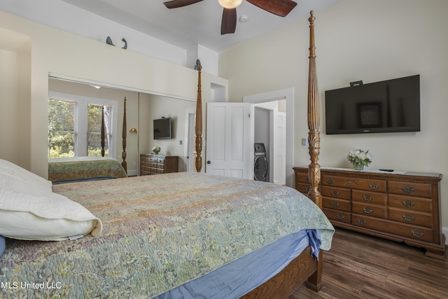 bedroom featuring washer / clothes dryer, dark wood-style flooring, a high ceiling, and ceiling fan