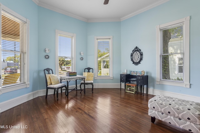 sitting room featuring crown molding, a ceiling fan, baseboards, and hardwood / wood-style flooring