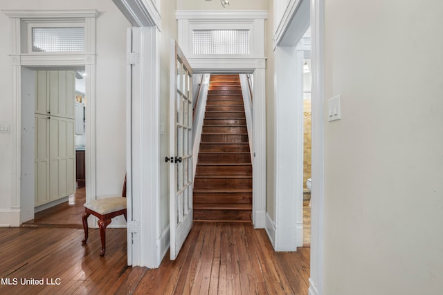 hallway with dark wood-type flooring