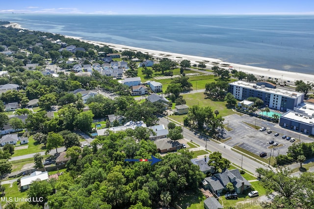 aerial view with a water view and a beach view