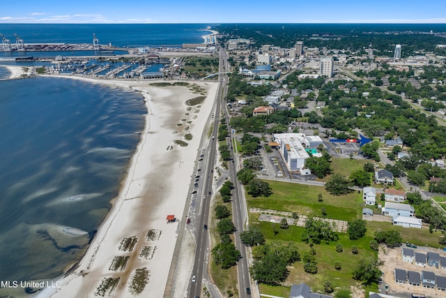 aerial view featuring a view of the beach and a water view