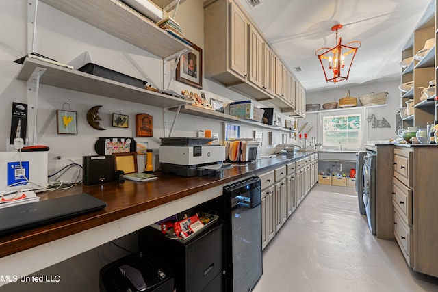 kitchen featuring a chandelier and wooden counters