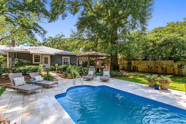 view of swimming pool featuring a gazebo and a patio