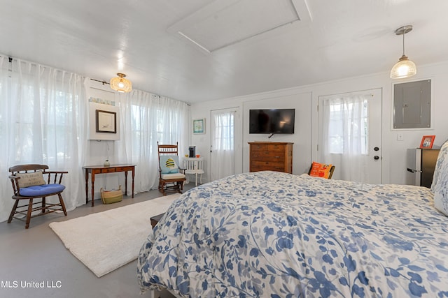 bedroom with concrete floors and electric panel