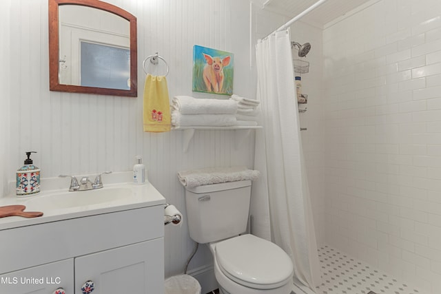 bathroom with vanity, a shower with shower curtain, and toilet