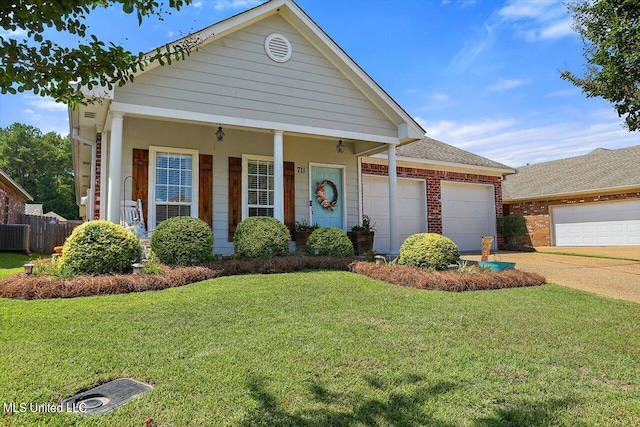 view of front of house featuring a front yard and a garage