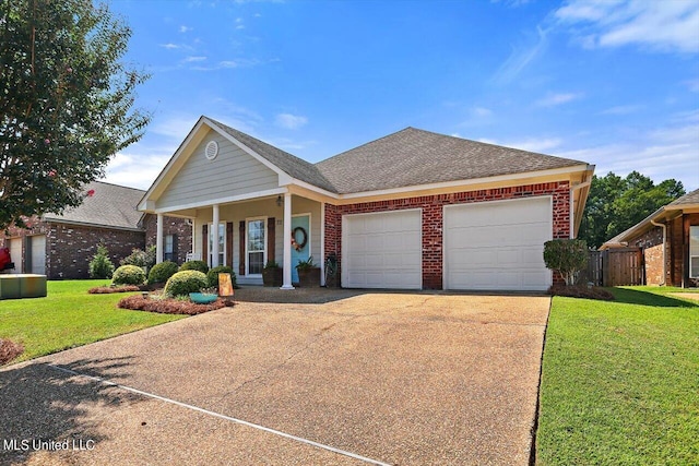 ranch-style home with covered porch, a front yard, and a garage