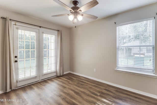 20 Oakmont Pl, Long Beach, MS 39560 - empty room with plenty of natural light, dark wood finished floors, and a ceiling fan