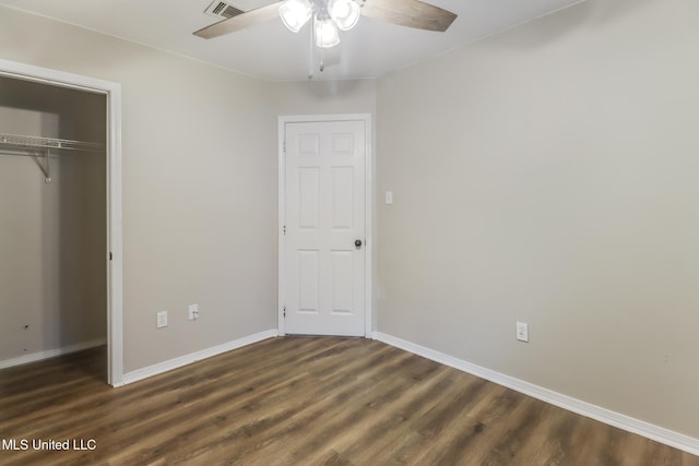 20 Oakmont Pl, Long Beach, MS 39560 - unfurnished bedroom featuring dark wood-style floors, a closet, and a ceiling fan
