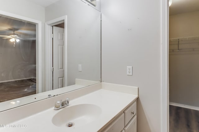 20 Oakmont Pl, Long Beach, MS 39560 - bathroom featuring wood finished floors, a ceiling fan, vanity, and a spacious closet