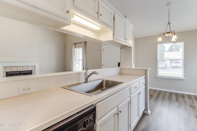 20 Oakmont Pl, Long Beach, MS 39560 - kitchen with white cabinets, healthy amount of natural light, wood finished floors, and light countertops