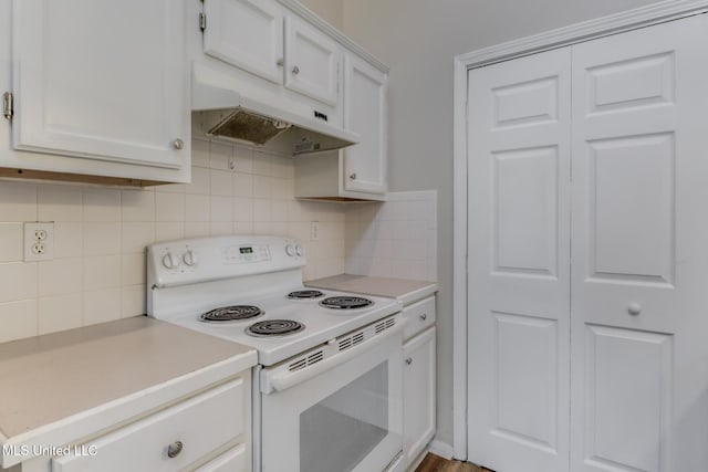 20 Oakmont Pl, Long Beach, MS 39560 - kitchen featuring white electric stove, under cabinet range hood, light countertops, and backsplash