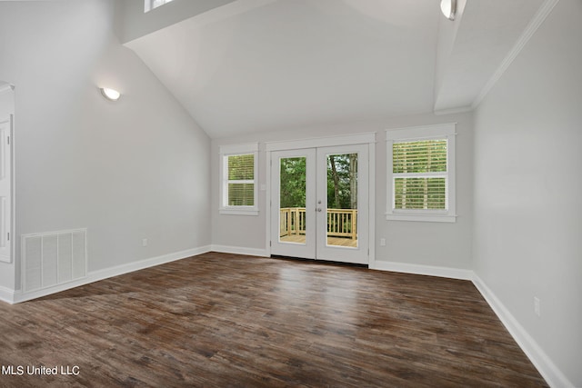 spare room with french doors, dark hardwood / wood-style floors, and a healthy amount of sunlight