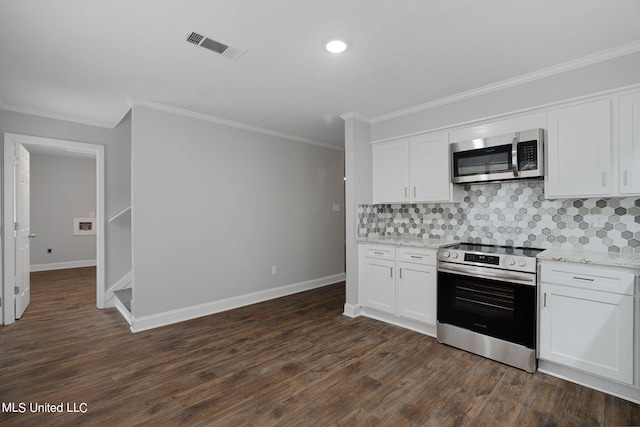 kitchen with ornamental molding, appliances with stainless steel finishes, white cabinetry, and dark hardwood / wood-style flooring