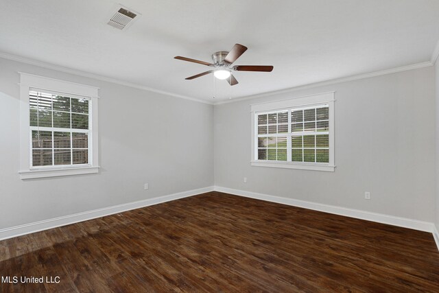 empty room with ceiling fan, crown molding, plenty of natural light, and hardwood / wood-style floors