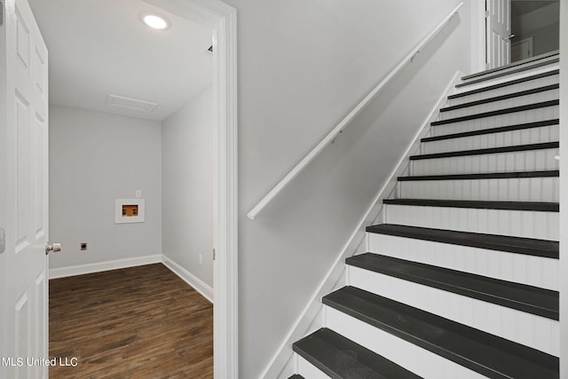 stairway featuring wood-type flooring