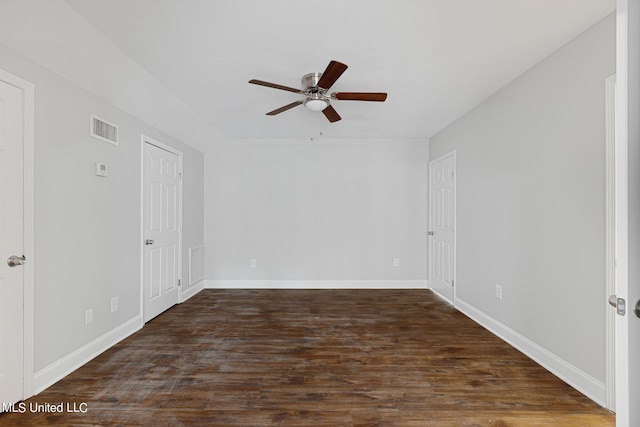 empty room with dark wood-type flooring and ceiling fan