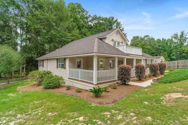 view of home's exterior with a porch and a yard