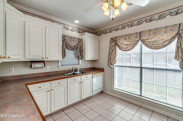 kitchen with crown molding, white dishwasher, white cabinetry, sink, and light tile patterned flooring