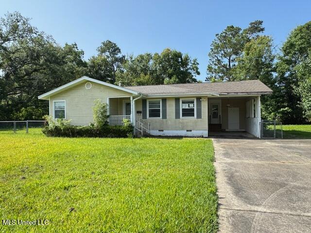 165 Canal St, Gulfport, MS 39507 - ranch-style home with crawl space, driveway, a porch, and a carport