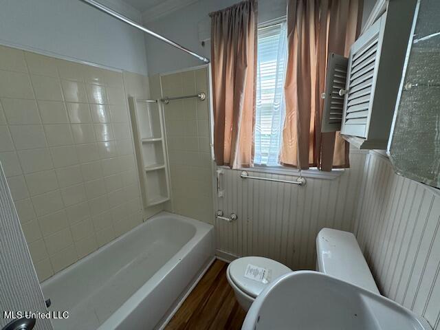 165 Canal St, Gulfport, MS 39507 - bathroom with toilet, bathtub / shower combination, and wood finished floors