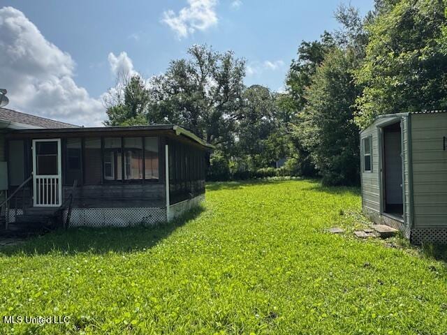 165 Canal St, Gulfport, MS 39507 - view of green lawn with a sunroom