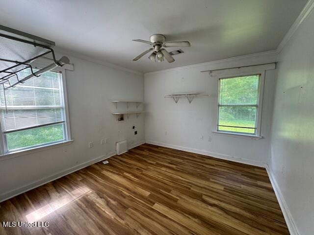 165 Canal St, Gulfport, MS 39507 - spare room with ornamental molding, plenty of natural light, wood finished floors, ceiling fan, and baseboards