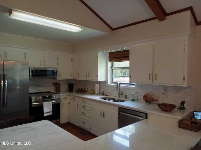 114 S 49th Hwy, Indianola, MS 38751 - kitchen with stainless steel appliances, a sink, backsplash, white cabinetry, and ornamental molding