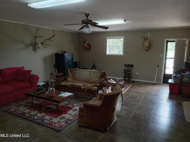 114 S 49th Hwy, Indianola, MS 38751 - living room featuring a ceiling fan, tile patterned floors, and baseboards