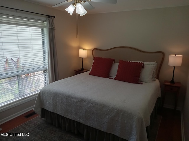 114 S 49th Hwy, Indianola, MS 38751 - bedroom featuring a ceiling fan, baseboards, and wood finished floors