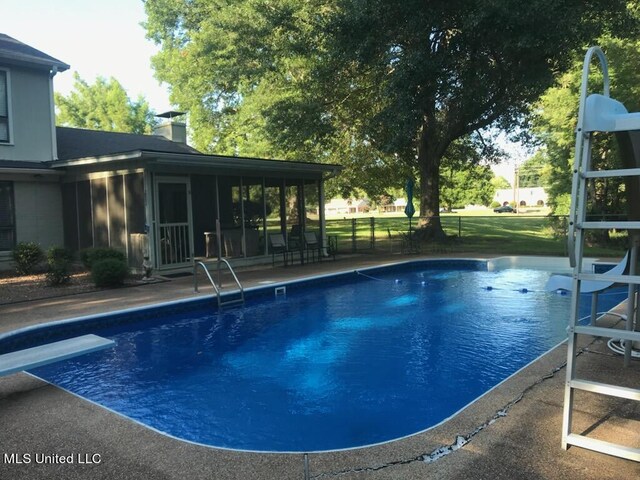 114 S 49th Hwy, Indianola, MS 38751 - outdoor pool with a diving board and a sunroom