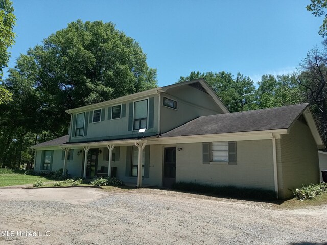 114 S 49th Hwy, Indianola, MS 38751 - view of front facade featuring covered porch, driveway, and roof with shingles
