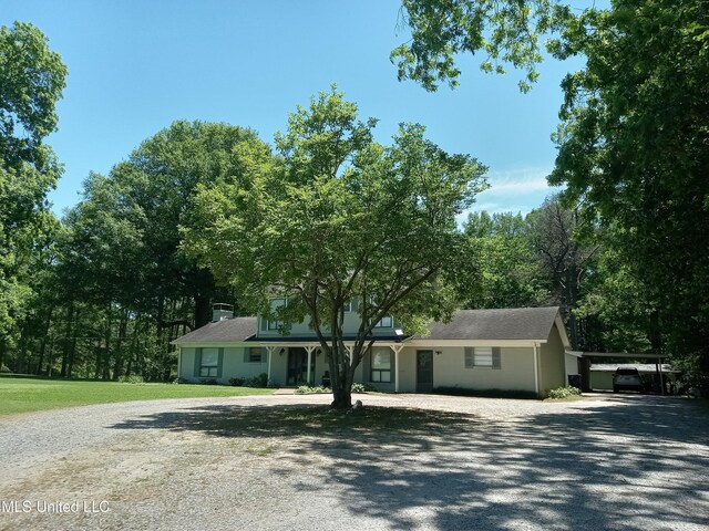 114 S 49th Hwy, Indianola, MS 38751 - ranch-style home with driveway, covered porch, a chimney, and a front lawn