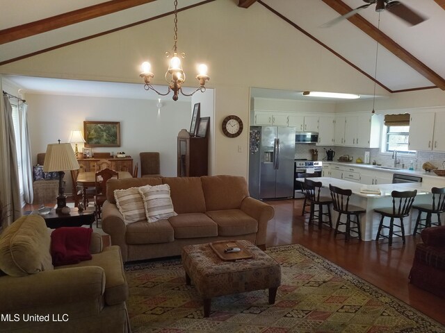 114 S 49th Hwy, Indianola, MS 38751 - living area with beamed ceiling, a ceiling fan, a chandelier, dark wood-style floors, and high vaulted ceiling