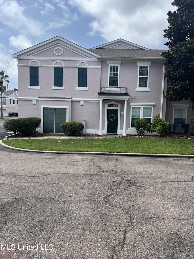 2252 Beach Dr Unit 606, Gulfport, MS 39507 - view of front of home featuring stucco siding and central AC unit
